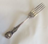 A silver dessert fork with shell decoration. Londo