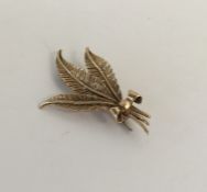 An unusual gold brooch in the form of a flower. Ap