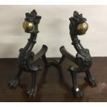 A pair of large brass and iron fire dogs. Est. £50