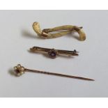 A Victorian gold stick pin together with a brooch