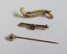 A Victorian gold stick pin together with a brooch