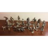 A collection of silver plated figures. Est. £20 -