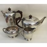 A stylish silver four piece silver tea service wit