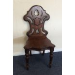 A mahogany shield back hall chair. Est. £30 - £50.