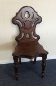 A mahogany shield back hall chair. Est. £30 - £50.