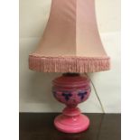 A pink glass lustre lamp. Est. £15 - £20.