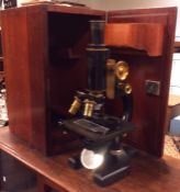 A mahogany cased Spencer microscope in case. Est.