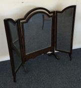 A mahogany triple mirror with outstretched legs. E