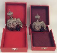 A boxed pair of silver and ebony figures of proces
