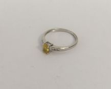 A diamond and yellow sapphire seven stone ring. Ap