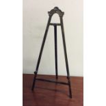 An unusual brass mounted easel with hinged back. E