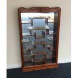 An Eastern hardwood display cabinet with fitted in
