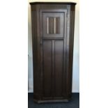 An oak hall cupboard with panelled sides. Est. £30