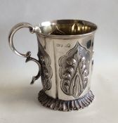 A good Victorian silver christening cup on spreadi