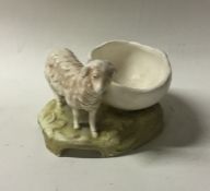 A Royal Dux figure of a sheep on rocky base. Est.