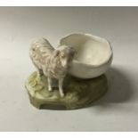 A Royal Dux figure of a sheep on rocky base. Est.