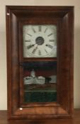 A mahogany cased wall clock with painted dial. Est