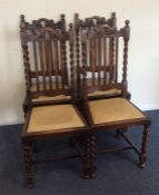 A set of four oak barley twist chairs. Est. £30 -