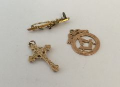 A small gold Masonic pendant together with a cross