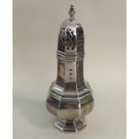 A heavy Edwardian silver sugar caster of hexagonal