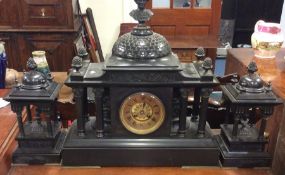 A large three piece slate clock garniture with bra