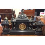 A large three piece slate clock garniture with bra