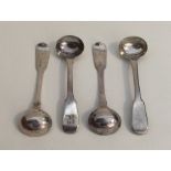 A set of four George III silver mustard spoons of