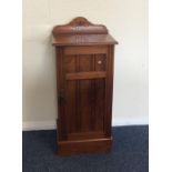 A walnut single door bedside cabinet. Est. £20 - £