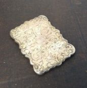 A Victorian silver hinged top card case with scrol