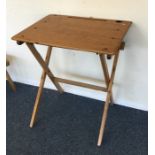 A folding pine child's desk. Est. £20 - £30.