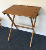 A folding pine child's desk. Est. £20 - £30.