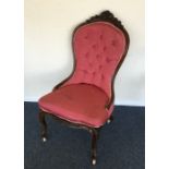 A Victorian mahogany button back chair with scroll