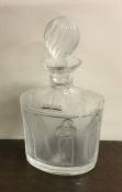 LALIQUE: A stylish glass decanter decorated with l