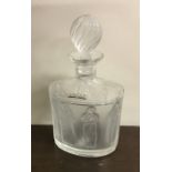 LALIQUE: A stylish glass decanter decorated with l