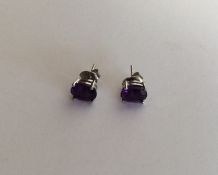 A pair of silver and amethyst ear studs. Approx. 2