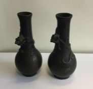 A pair of heavy Japanese bronze vases of baluster