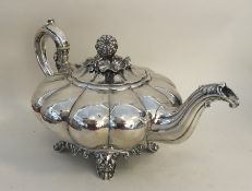 A good heavy Victorian silver teapot of melon desi
