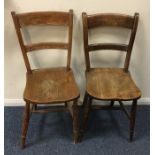 A pair of elm kitchen chairs. Est. £20 - £30.