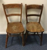 A pair of elm kitchen chairs. Est. £20 - £30.