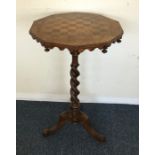 A Victorian games table on barley twist support. E