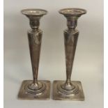 A tall pair of American silver tapering candlestic