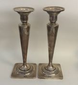 A tall pair of American silver tapering candlestic