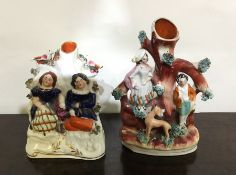 Two Staffordshire flatback figures on oval bases.
