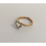 A 9 carat diamond mounted heart shaped ring. Appro