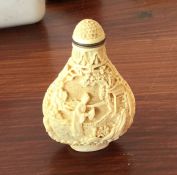 A good quality carved ivory scent bottle decorated