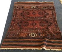 A small Oriental rug. Est. £25 - £35.