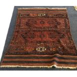 A small Oriental rug. Est. £25 - £35.