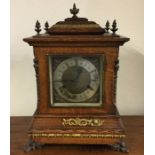 A large oak cased bracket clock with silvered dial