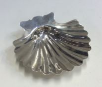 An unusual Georgian silver butter shell with shape