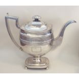 A George III silver coffee pot on square base with